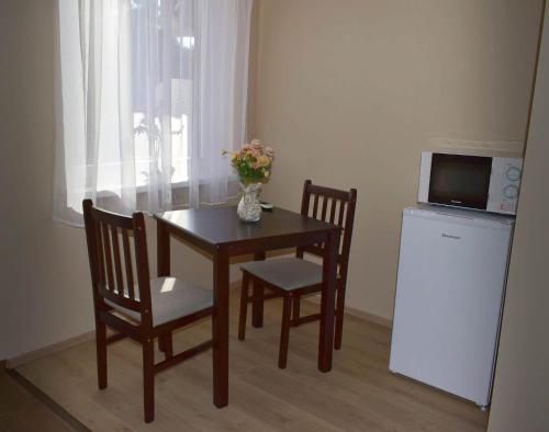 Kuchyň nebo kuchyňský kout v ubytování Napfény Apartman