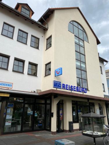 a building with a sign on the front of it at Ferienwohnung Wessels in Kassel