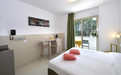 Кровать или кровати в номере Hotel Meublè Nazionale