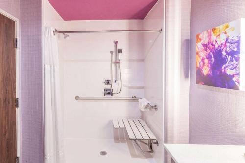 a bathroom with a shower and a sink and a toilet at La Quinta by Wyndham Houston East at Sheldon Rd in Channelview