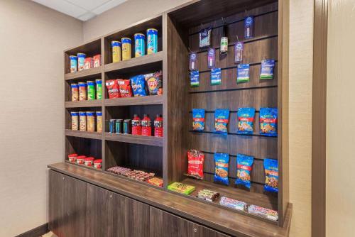 a shelf filled with lots of food in a store at La Quinta by Wyndham Jamestown in Jamestown