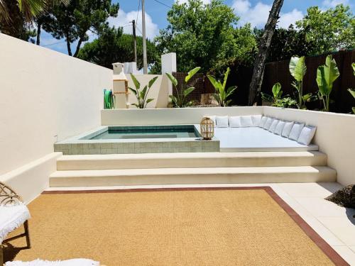a backyard with a plunge pool and stairs at The Mill - Sintra in Sintra