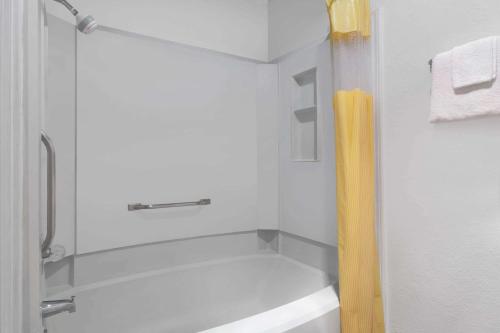 a bathroom with a shower and a sink at Days Inn by Wyndham Ardmore in Ardmore