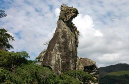 a large rock formation on top of a mountain at Pedra Do Imperador in Nova Friburgo
