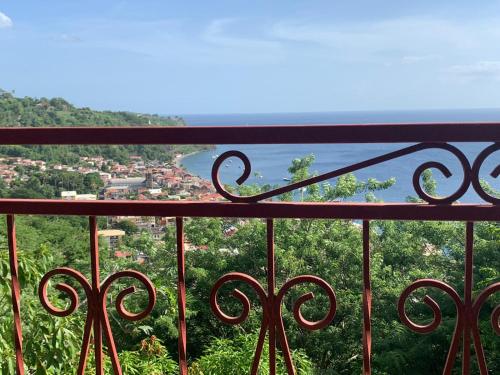a view of the ocean from a balcony at The Kapokier in Saint-Pierre