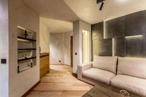 a living room with a couch and a kitchen at Bella Roe Premium Apartments in Belgrade