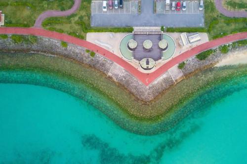 an aerial view of a resort on the water at Ocean view Shiozaki in Maezato