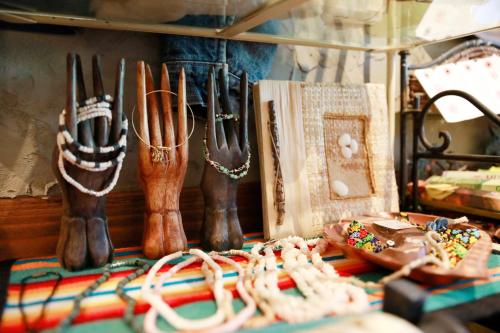 a group of cowboy boots on a shelf at Pension Kamifuji in Osaki