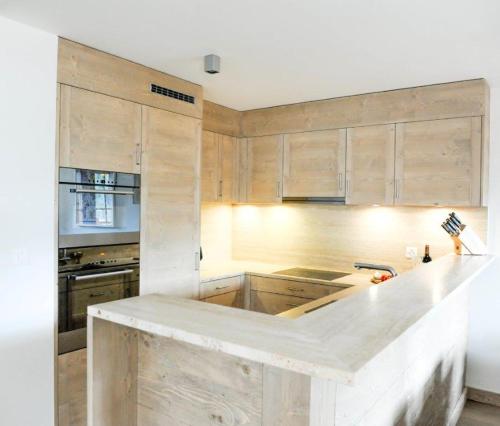 Kuchyň nebo kuchyňský kout v ubytování Luxury Grimentz Apartment