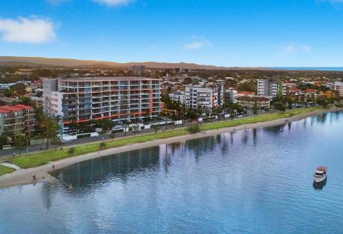 an aerial view of a city and a river at Silvershore Apartments on the Broadwater in Gold Coast