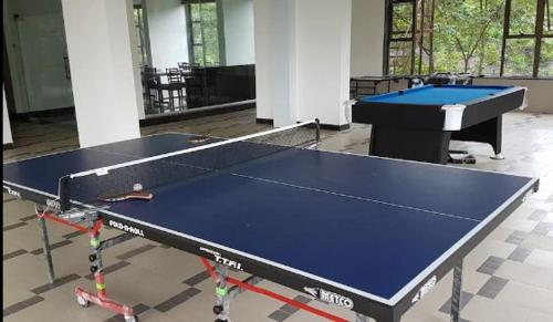 a large ping pong table in a room at Hotel Lalit Inn in Khandala