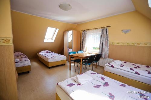 En eller flere senger på et rom på Pokoje Gościnne Via Steso