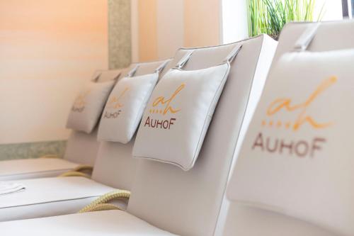 a row of white chairs lined up in a row at Hotel Auhof Kappl in Kappl