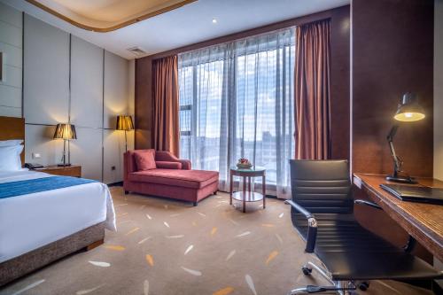 Postel nebo postele na pokoji v ubytování Relteem Hotel