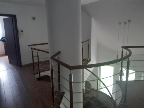 a glass staircase in a room with a hallway at Domek na Mazurach-Piasutno in Piasutno