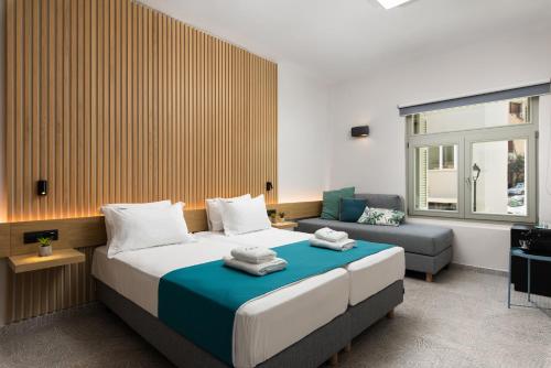 Ένα ή περισσότερα κρεβάτια σε δωμάτιο στο Lignum Suites Chania