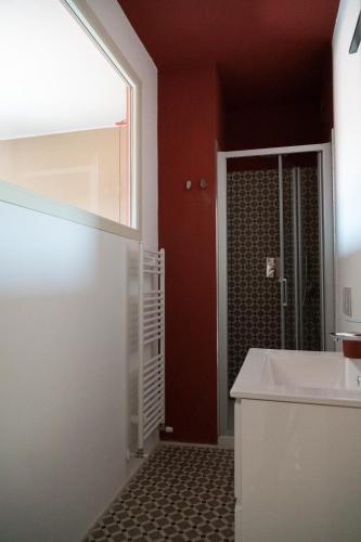 a bathroom with a shower and a white sink at La Bastia - Bed & Soul in Nuvolento