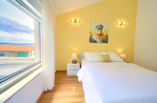 Postel nebo postele na pokoji v ubytování Holiday House Mar