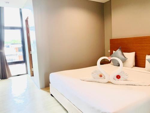 Ένα ή περισσότερα κρεβάτια σε δωμάτιο στο Behind The Scene Hotel Club @ Samui