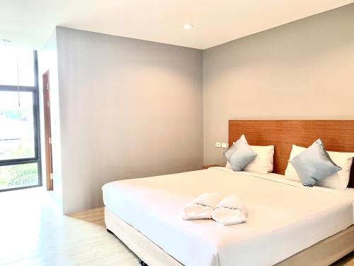 Ένα ή περισσότερα κρεβάτια σε δωμάτιο στο Behind The Scene Hotel Club @ Samui