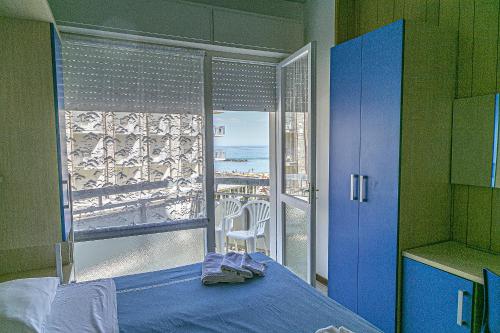 En eller flere senge i et værelse på Hotel Tropical