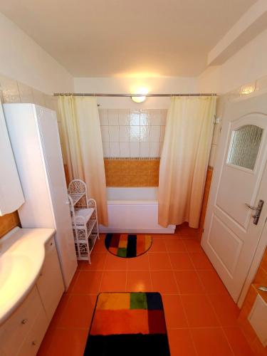 a bathroom with a tub and a sink and a shower at Casa Matilda in Constanţa