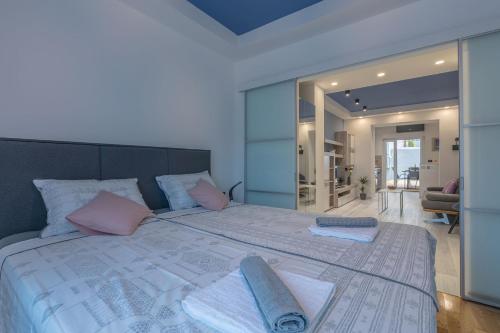 a bedroom with a large bed with towels on it at Arena Blue Dream - modern apartment with terrace in Pula