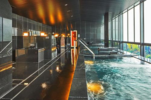 a bathroom with a pool of water in a building at Hotel Emion Kyoto in Kyoto