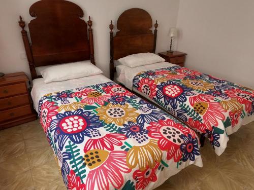 En eller flere senge i et værelse på Casa Paris