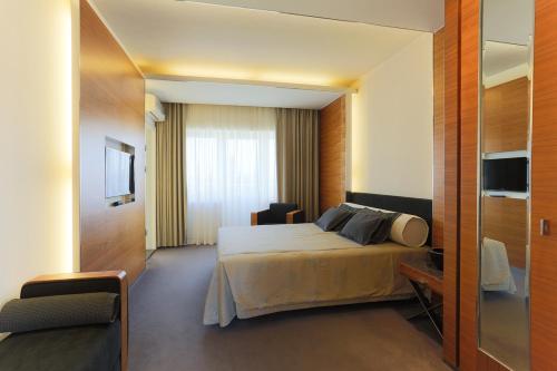 Una cama o camas en una habitación de Rannahotell