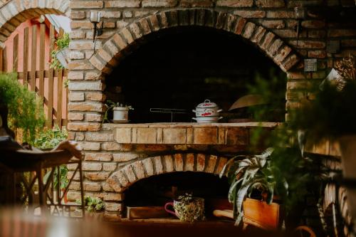 an outdoor brick oven in a yard with a table at Lavanda in Vukovar