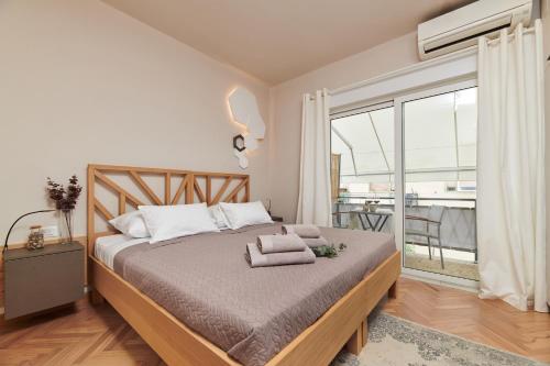a bedroom with a bed with towels on it at Rooms Izidoro Gasparini in Umag