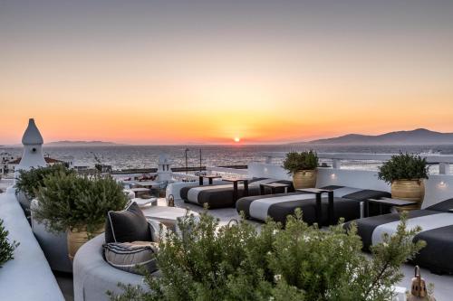 a view of the sunset from the rooftop of a hotel at The TownHouse Mykonos in Mikonos