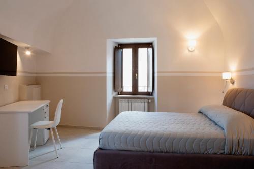 Säng eller sängar i ett rum på Residenza Cappelli - Affittacamere