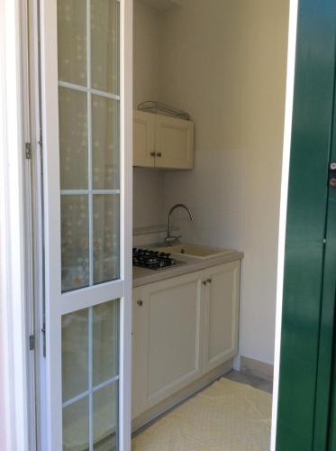 a small kitchen with a sink and a stove at Ca Lorelei in Riomaggiore