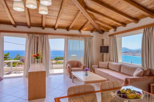 a living room with a couch and a table at PENNY LUXURY APARTMENTS in Kokkari
