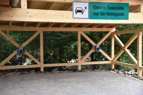 a wooden bridge with a sign on top of it at Hotel Fischzucht in Würzburg in Würzburg