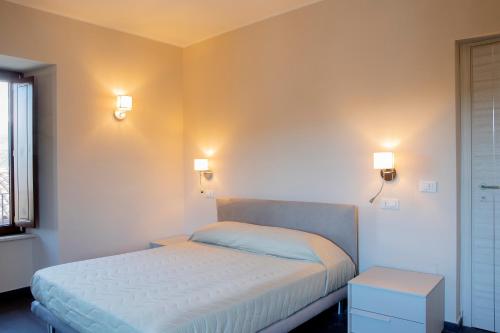 Ένα ή περισσότερα κρεβάτια σε δωμάτιο στο Residenza Cappelli - Affittacamere