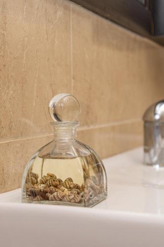 a glass jar filled with rocks on top of a counter at סטודיו 10 studio in Eilat