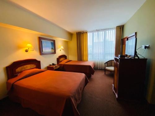 Кровать или кровати в номере Hotel Continental Lima