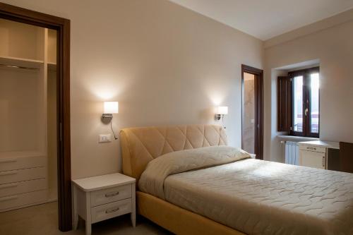 Un pat sau paturi într-o cameră la Residenza Cappelli - Case Vacanze