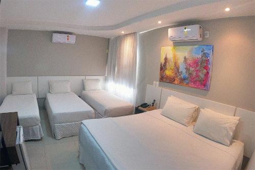 Katil atau katil-katil dalam bilik di Hotel Pedra Negra Gov. Valadares