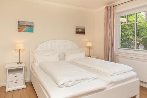 Postel nebo postele na pokoji v ubytování Haus Watthus - Wohnung Paradies
