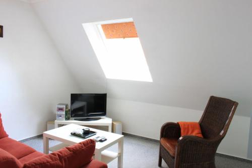 TV a/nebo společenská místnost v ubytování Gaestehaus-Sylvie-Wohnung-2