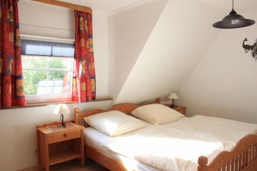 Postel nebo postele na pokoji v ubytování Gaestehaus-Sylvie-Wohnung-2