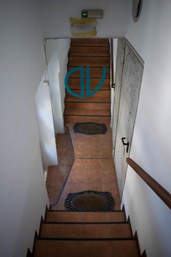 a view of a staircase with a blue ring on it at Dolichi View in Pythagoreio