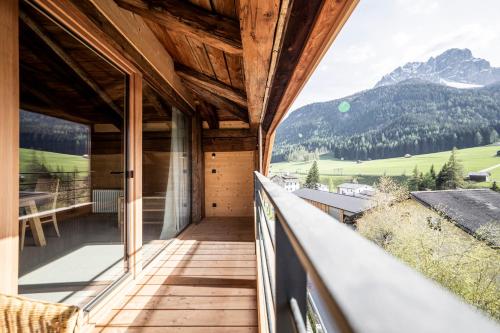 a balcony with a view of the mountains at Wassermann in Sesto