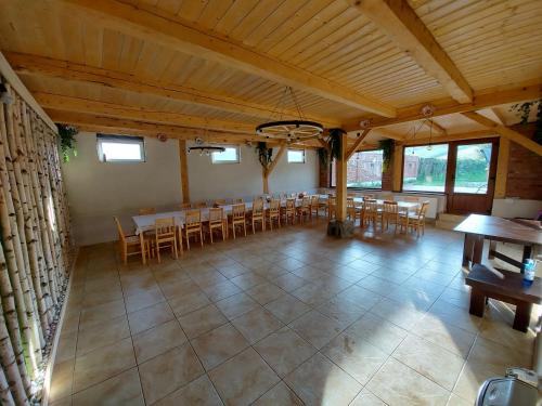 a large room with a table and chairs in it at Casa Simion in Sibiu