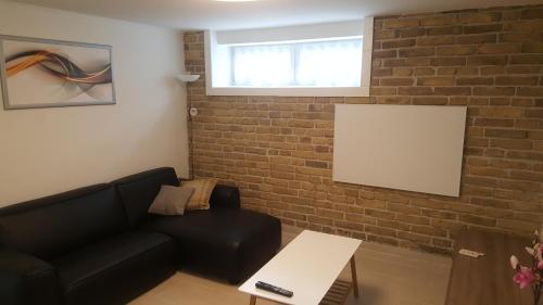 Orhidea Szuterén Apartmanにあるシーティングエリア