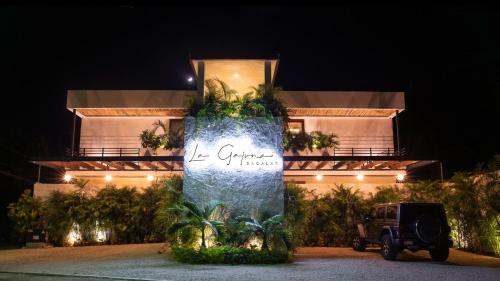 a building with a sign that reads la orientacienda at La Galuna Bacalar in Bacalar